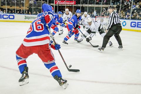 NEW YORK, NY – FEBRUARY 04: Puck slides back to New York Rangers right wing Mats Zuccarello (36) after faceoff between New York Rangers center Mika Zibanejad (93) and Los Angeles Kings center Anze Kopitar (11) during the Los Angeles Kings and New York Rangers NHL game on February 4, 2019, at Madison Square Garden in New York, NY. (Photo by John Crouch/Icon Sportswire via Getty Images)