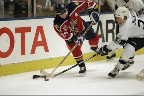 22 Jan 1998: Defenseman Robert Svehla of the Florida Panthers in action against leftwinger Craig Johnson of the Los Angeles Kings during a game at the Great Western Forum in Inglewood, California. The Kings defeated the Panthers 4-2. Mandatory Credit: E