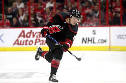 RALEIGH, NC – APRIL 15: Haydn Fleury #4 of the Carolina Hurricanes fires a slap shot in Game Three of the Eastern Conference First Round against the Washington Capitals during the 2019 NHL Stanley Cup Playoffs on April 15, 2019 at PNC Arena in Raleigh, North Carolina. (Photo by Gregg Forwerck/NHLI via Getty Images)