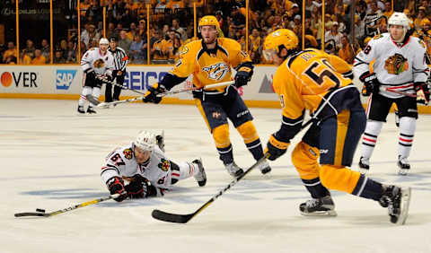 NASHVILLE, TN – APRIL 20: Tanner Kero #67 of the Chicago Blackhawks falls in front of Roman Josi #59 of the Nashville Predators  (Photo by Frederick Breedon/Getty Images)