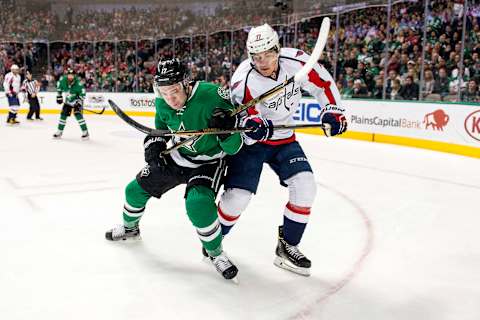 Jan 21, 2017; Dallas, TX, USA; Dallas Stars center Devin Shore (17) and Washington Capitals right wing T.J. Oshie (77) fight for the puck during the third period at the American Airlines Center. The Capitals defeat the Stars 4-3 in overtime. Mandatory Credit: Jerome Miron-USA TODAY Sports