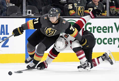 LAS VEGAS, NEVADA – NOVEMBER 29: William Karlsson #71 of the Vegas Golden Knights skates with the puck against Christian Dvorak #18 of the Arizona Coyotes in overtime of their game at T-Mobile Arena on November 29, 2019 in Las Vegas, Nevada. The Golden Knights defeated the Coyotes 2-1 in a shootout. (Photo by Ethan Miller/Getty Images)