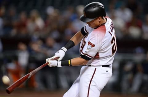 Jun 7, 2017; Phoenix, AZ, USA; Arizona Diamondbacks third baseman Jake Lamb (22) hits a pitch against the San Diego Padres during the fifth inning at Chase Field. Mandatory Credit: Joe Camporeale-USA TODAY Sports