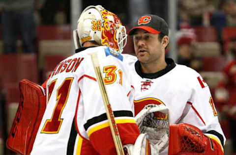 Nov 20, 2016; Detroit, MI, USA; Calgary Flames goalie Brian Elliott (right) shakes hands with goalie Chad Johnson (31) after the game against the Detroit Red Wings at Joe Louis Arena. Flames won 3-2. Mandatory Credit: Raj Mehta-USA TODAY Sports