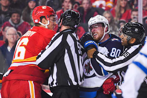 Nikita Zadorov #16, Calgary Flames; Pierre-Luc Dubois #80, Winnipeg Jets. (Photo by Derek Leung/Getty Images)