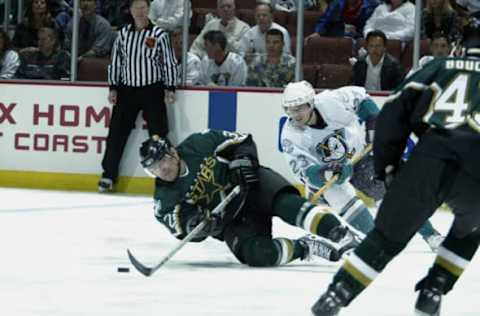 ANAHEIM, CA – APRIL 28: Stanislav Chistov #23 of the Mighty Ducks of Anaheim takes Claude Lemieux #32 of the Dallas Stars to the ice during the 2003 Western Conference Semifinals of the Stanley Cup playoffs at the Arrowhead Pond of Anaheim on April 28, 2003 in Anaheim, California. The Stars defeated the Ducks 2-1. (Photo by Donald Miralle/Getty Images/NHLI)