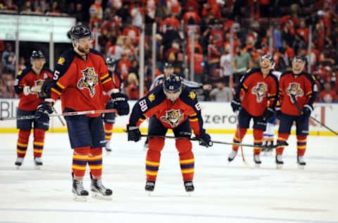 Apr 14, 2016; Sunrise, FL, USA; Florida Panthers right winger Jaromir Jagr (68) and defenseman Aaron Ekblad (5) skate off the ice after being defeated 5-4 by the New York Islanders in game one of the first round of the 2016 Stanley Cup Playoffs at BB&T Center. Mandatory Credit: Robert Duyos-USA TODAY Sports