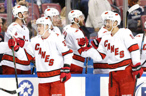 SUNRISE, FLORIDA – OCTOBER 08: Andrei Svechnikov #37 and Dougie Hamilton #19 of the Carolina Hurricanes celebrate with teammates after a goal against the Florida Panthers during the first period at BB&T Center on October 08, 2019 in Sunrise, Florida. (Photo by Michael Reaves/Getty Images)