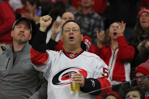 RALEIGH, NC – DECEMBER 29: A fan celebrates a goal during the 2nd period of the Carolina Hurricanes game versus the Pittsburgh Penguins on December 29, 2017, at PNC Arena in Raleigh, NC. (Photo by Jaylynn Nash/Icon Sportswire via Getty Images)