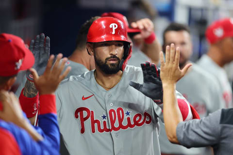 MIAMI, FLORIDA – APRIL 15: Nick Castellanos #8 of the Philadelphia Phillies high fives teammates after hitting a solo home run during the eighth inning against the Miami Marlins at loanDepot park on April 15, 2022 in Miami, Florida. All players are wearing the number 42 in honor of Jackie Robinson Day. (Photo by Michael Reaves/Getty Images)