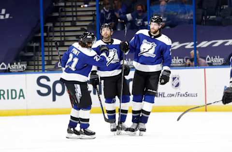 Mar 18, 2021; Tampa, Florida, USA; Tampa Bay Lightning defenseman Victor Hedman (77) is congratulated as he scores a goal against the Chicago Blackhawks during the third period at Amalie Arena. Mandatory Credit: Kim Klement-USA TODAY Sports