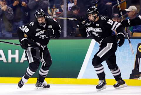 Apr 9, 2015; Boston, MA, USA; Providence College Friars forward Mark Jankowski (10) celebrates with defenseman Jake Walman (19) after scoring a goal against the Nebraska-Omaha Mavericks during the second period of the semifinal game in the men’s Frozen Four college ice hockey tournament at TD Garden. Mandatory Credit: Greg M. Cooper-USA TODAY Sports