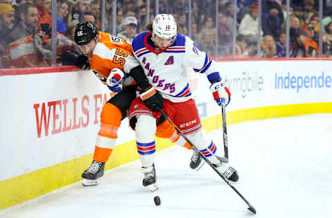 PHILADELPHIA, PENNSYLVANIA – MARCH 01: Rasmus Ristolainen #55 of the Philadelphia Flyers and Artemi Panarin #10 of the New York Rangers challenge for the puck at Wells Fargo Center on March 01, 2023 in Philadelphia, Pennsylvania. (Photo by Tim Nwachukwu/Getty Images)