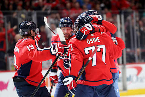 WASHINGTON, DC – NOVEMBER 18: Nicklas Backstrom #19, Evgeny Kuznetsov #92, and T.J. Oshie #77 celebrate with Alex Ovechkin #8 of the Washington Capitals after Ovechkin scored a second period goal against the Anaheim Ducks at Capital One Arena on November 18, 2019 in Washington, DC. (Photo by Rob Carr/Getty Images)