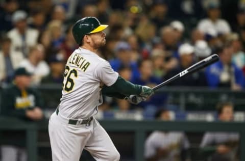 Sep 29, 2016; Seattle, WA, USA; Oakland Athletics right fielder Danny Valencia (26) hits a double against the Seattle Mariners during the second inning at Safeco Field. Mandatory Credit: Joe Nicholson-USA TODAY Sports