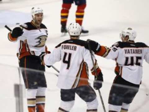 Nov 19, 2015; Sunrise, FL, USA; Anaheim Ducks defenseman Cam Fowler (4) celebrates his goal with center Ryan Getzlaf (15) and defenseman Sami Vatanen (45) in the second period of a game against the Florida Panthers at BB&T Center. Mandatory Credit: Robert Mayer-USA TODAY Sports