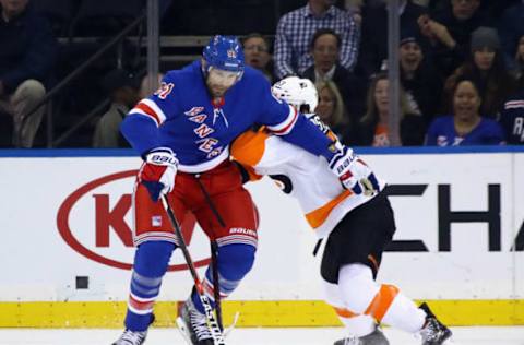 NEW YORK, NY – JANUARY 16: Rick Nash #61 of the New York Rangers attempts to get past Shayne Gostisbehere #53 of the Philadelphia Flyers at Madison Square Garden on January 16, 2018, in New York City. The Rangers defeated the Flyers 5-1. (Photo by Bruce Bennett/Getty Images)