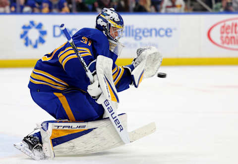 Mar 9, 2023; Buffalo, New York, USA; Buffalo Sabres goaltender Eric Comrie (31) makes a glove save during the third period against the Dallas Stars at KeyBank Center. Mandatory Credit: Timothy T. Ludwig-USA TODAY Sports