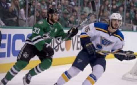 May 7, 2016; Dallas, TX, USA; St. Louis Blues center Robby Fabbri (15) and Dallas Stars defenseman Alex Goligoski (33) watch the puck during the first period in game five of the second round of the 2016 Stanley Cup Playoffs at American Airlines Center. Fabbri and Goligoski each score a goal. Mandatory Credit: Jerome Miron-USA TODAY Sports