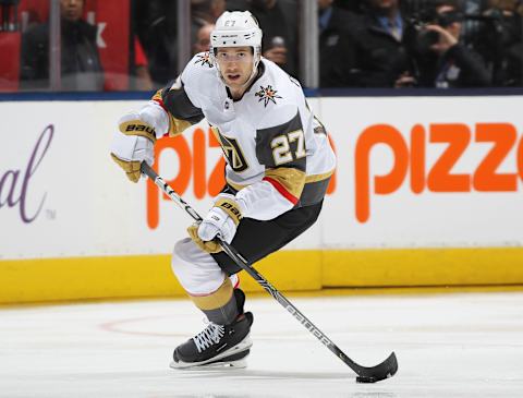 Shea Theodore #27 of the Vegas Golden Knights skates with the puck against the Toronto Maple Leafs. (Photo by Claus Andersen/Getty Images)