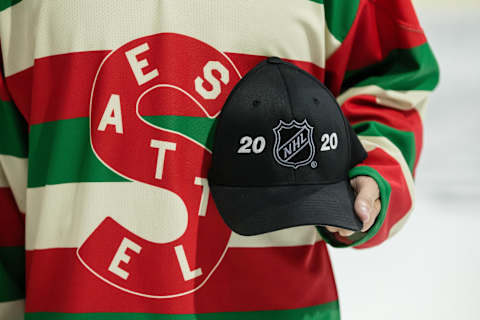 EVERETT, WA – DECEMBER 01: An Everett Silvertips fan wears a vintage Seattle Metropolitans jersey and holds an NHL Seattle hat before a game between the Kootenay Ice and the Everett Silvertips on Saturday, December 1, 2019 at Angel of the Winds Arena in Everett, WA. (Photo by Christopher Mast/Icon Sportswire via Getty Images)