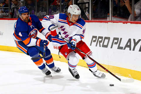 NEW YORK, NY – APRIL 05: Vladislav Namestnikov #90 of the New York Rangers carries the puck amid pressure from Dennis Seidenberg #4 of the New York Islanders during the second period at Barclays Center on April 5, 2018 in New York City. (Photo by Mike Stobe/NHLI via Getty Images)