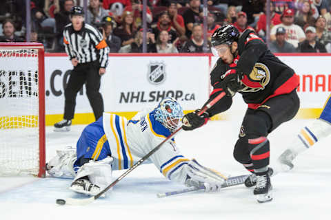 Oct 24, 2023; Ottawa, Ontario, CAN; Buffalo Sabres goalie Ukko-Pekka Luukkonen (1) makes a save on a shot from Ottawa Senators right wing Drake Batherson (19) in the first period at the Canadian Tire Centre. Mandatory Credit: Marc DesRosiers-USA TODAY Sports