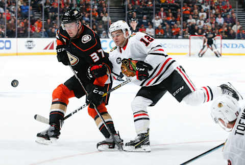 ANAHEIM, CA – FEBRUARY 27: Nick Ritchie #37 of the Anaheim Ducks and Alex DeBrincat #12 of the Chicago Blackhawks battle for the puck during the third period of the game at Honda Center on February 27, 2019 in Anaheim, California. (Photo by Debora Robinson/NHLI via Getty Images)