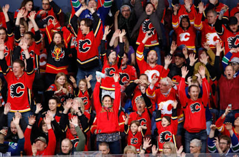 CALGARY, AB – DECEMBER 29: Fans cheer during an NHL game between the Calgary Flames and Vancouver Canucks on December 29, 2018 at the Scotiabank Saddledome in Calgary, Alberta, Canada. (Photo by Gerry Thomas/NHLI via Getty Images)