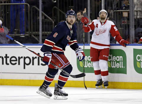 Apr 9, 2016; New York, NY, USA; New York Rangers defenseman Dylan McIlrath (6) skates to the bench past Detroit Red Wings defenseman Niklas Kronwall (55) after the Rangers scored a goal during the third period at Madison Square Garden. The Rangers defeated the Red Wings 3-2. Mandatory Credit: Adam Hunger-USA TODAY Sports