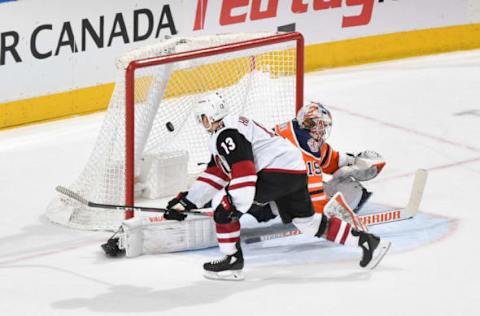 EDMONTON, AB – FEBRUARY 19: Vinnie Hinostroza #13 of the Arizona Coyotes scores the game winning shoot out goal on Mikko Koskinen #19 of the Edmonton Oilers on February 19, 2019 at Rogers Place in Edmonton, Alberta, Canada. (Photo by Andy Devlin/NHLI via Getty Images)