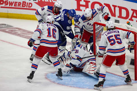 TAMPA, FLORIDA – JUNE 05: Steven Stamkos #91 of the Tampa Bay Lightning drives to the net ahead of Igor Shesterkin #31 of the New York Rangers during the first period in Game Three of the Eastern Conference Final of the 2022 Stanley Cup Playoffs at Amalie Arena on June 05, 2022 in Tampa, Florida. (Photo by Mike Carlson/Getty Images)