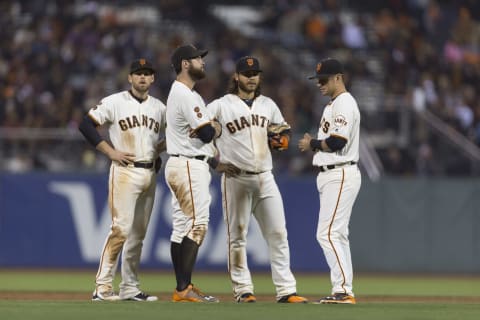 Sep 28, 2016; San Francisco, CA, USA; during a pitching change San Francisco Giants shortstop Brandon Crawford (35) and second baseman Joe Panik (12) and first baseman Brandon Belt (9) and third baseman Conor Gillaspie (21) talk at AT&T Park. Mandatory Credit: Neville E. Guard-USA TODAY Sports