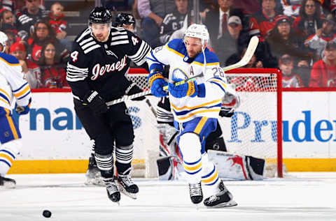 NEWARK, NEW JERSEY – APRIL 11: Zemgus Girgensons #28 of the Buffalo Sabres against the New Jersey Devils at the Prudential Center on April 11, 2023 in Newark, New Jersey. (Photo by Bruce Bennett/Getty Images)