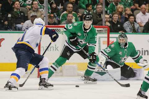 DALLAS, TX – MARCH 03: St. Louis Blues center Brayden Schenn (10) tries to shoot the puck past Dallas Stars defenseman Esa Lindell (23) and goaltender Ben Bishop (30) during the game between the Dallas Stars and the St. Louis Blues on March 3, 2018 at the American Airlines Center in Dallas, Texas. (Photo by Matthew Pearce/Icon Sportswire via Getty Images)