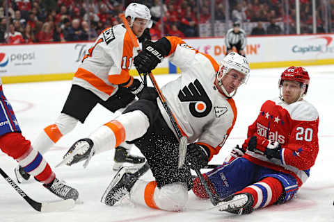 WASHINGTON, DC – FEBRUARY 08: Kevin Hayes #13 of the Philadelphia Flyers and Lars Eller #20 of the Washington Capitals battle for the puck during the second period at Capital One Arena on February 08, 2020 in Washington, DC. (Photo by Patrick Smith/Getty Images)