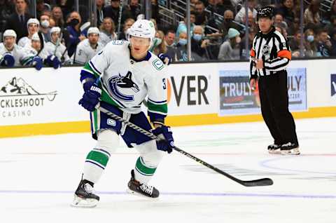 SEATTLE, WASHINGTON – OCTOBER 23: Jack Rathbone #3 of the Vancouver Canucks skates against the Seattle Kraken during the franchise’s inaugural home game at the Climate Pledge Arena on October 23, 2021 in Seattle, Washington. (Photo by Bruce Bennett/Getty Images)