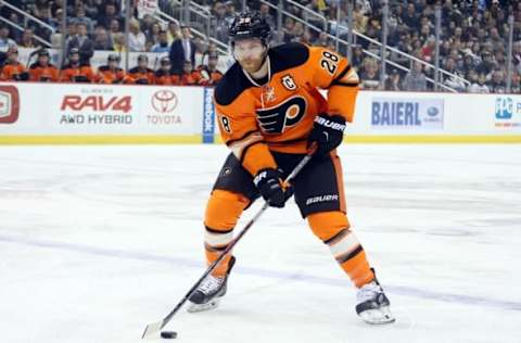 Apr 3, 2016; Pittsburgh, PA, USA; Philadelphia Flyers center Claude Giroux (28) carries the puck into the offensive zone against the Pittsburgh Penguins during the first period at the CONSOL Energy Center. Mandatory Credit: Charles LeClaire-USA TODAY Sports