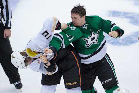 Apr 23, 2014; Dallas, TX, USA; Dallas Stars left wing Antoine Roussel (21) fights Anaheim Ducks right wing Corey Perry (10) during the third period in game four of the first round of the 2014 Stanley Cup Playoffs at American Airlines Center. The Stars defeated the Ducks 4-2. Mandatory Credit: Jerome Miron-USA TODAY Sports