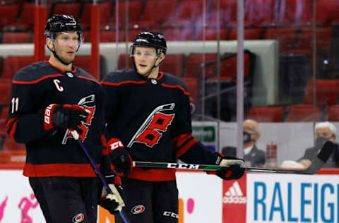 RALEIGH, NORTH CAROLINA – JANUARY 28: Jordan Staal #11 and Steven Lorentz #78 of the Carolina Hurricanes look on during the first period of their game against the Tampa Bay Lightning at PNC Arena on January 28, 2021, in Raleigh, North Carolina. (Photo by Jared C. Tilton/Getty Images)