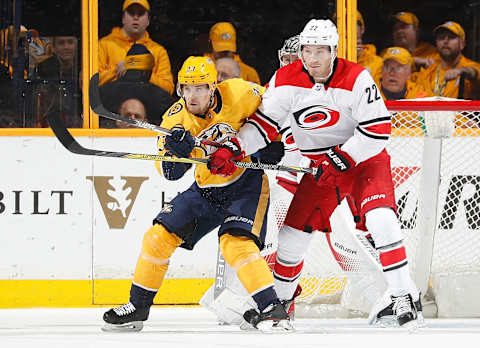 NASHVILLE, TN – DECEMBER 21: Viktor Arvidsson #33 of the Nashville Predators battles against Brett Pesce #22 of the Carolina Hurricanes during an NHL game at Bridgestone Arena on December 21, 2017 in Nashville, Tennessee. (Photo by John Russell/NHLI via Getty Images)