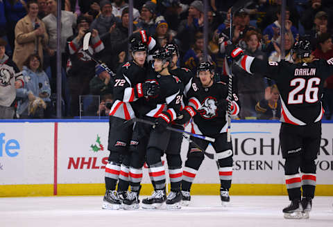 Dec 4, 2022; Buffalo, New York, USA; Buffalo Sabres center Tage Thompson (72) celebrates his gaol with teammates during the first period against the San Jose Sharks at KeyBank Center. Mandatory Credit: Timothy T. Ludwig-USA TODAY Sports