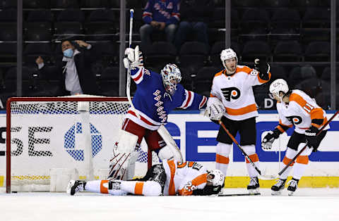 Igor Shesterkin #31 of the New York Rangers signals for help after James van Riemsdyk #25 of the Philadelphia Flyers falls to the ice Credit: Elsa/POOL PHOTOS-USA TODAY Sports