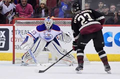 Nov 25, 2016; Glendale, AZ, USA; Arizona Coyotes defenseman Oliver Ekman-Larsson (23) scores on Edmonton Oilers goalie Cam Talbot (33) during a shootout at Gila River Arena. Mandatory Credit: Matt Kartozian-USA TODAY Sports