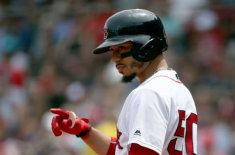 BOSTON, MA – JULY 29: Mookie Betts #50 of the Boston Red Sox gestures before batting against the Minnesota Twins in the first inning at Fenway Park on July 29, 2018 in Boston, Massachusetts. (Photo by Jim Rogash/Getty Images)