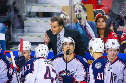 Feb 5, 2016; Calgary, Alberta, CAN; Fans hold a sign of Columbus Blue Jackets head coach John Tortorella while he is talking to his players during the third period against the Calgary Flames at Scotiabank Saddledome. Columbus Blue Jackets won 2-1. Mandatory Credit: Sergei Belski-USA TODAY Sports