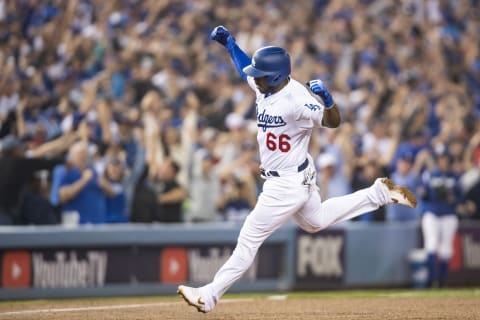 LOS ANGELES, CA – OCTOBER 27: Yasiel Puig #66 of the Los Angeles Dodgers reacts after hitting a three run home run during the sixth inning of game four of the 2018 World Series against the Boston Red Sox on October 27, 2018 at Dodger Stadium in Los Angeles, California. (Photo by Billie Weiss/Boston Red Sox/Getty Images)