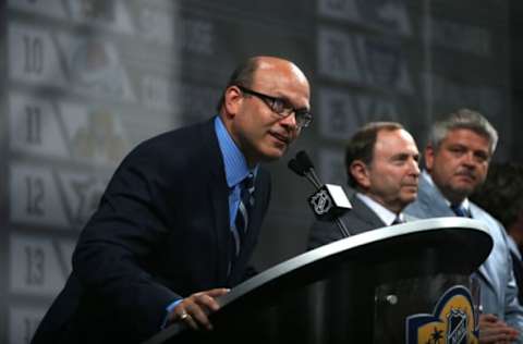 SUNRISE, FL – JUNE 26: Edmonton Oilers General Manager Peter Chiarelli addresses the audience as NHL Commissioner Gary Bettman and Oilers head coach Todd McClellan look on during Round One of the 2015 NHL Draft at BB