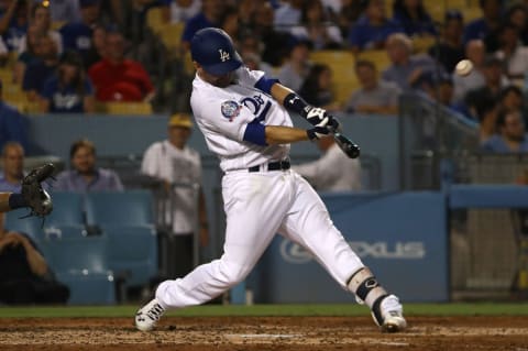 LOS ANGELES, CA – AUGUST 01:Brian Dozier #6 of the Los Angeles Dodgers hits a solo homerun during the fifth inning of the MLB game against the Milwaukee Brewers at Dodger Stadium on August 1, 2018 in Los Angeles, California. (Photo by Victor Decolongon/Getty Images)