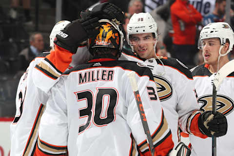 DENVER, CO – OCTOBER 26: Derek Grant #38 of the Anaheim Ducks celebrates a win with teammate goaltender Ryan Miller #30 after a win against the Colorado Avalanche at the Pepsi Center on October 26, 2019 in Denver, Colorado. The Ducks defeated the Avalanche 5-2. (Photo by Michael Martin/NHLI via Getty Images)